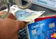 Ilfov. Percheziţii la persoane bănuite de clonare de carduri bancare în mod fraudulos